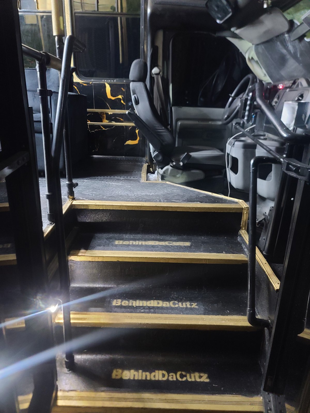 BehindDaCutz branded entry steps with gold trim